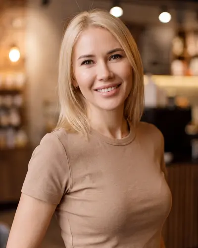 AI example made from that photo: the same woman in a beige t-shirt in a cafe
