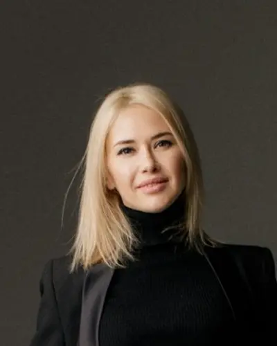Original photo: a blonde woman in a black suit
