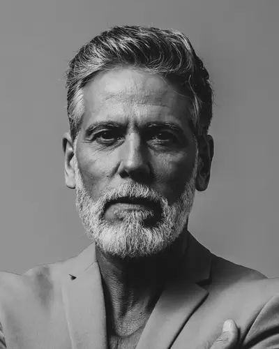 Original photo: an older man with a gray beard, black and white photo